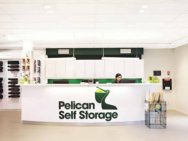 Pelican front desk with woman